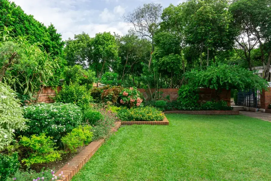 OnTime Landscape & Tree Maintenance carrying out garden maintenance work in Logan Reserve