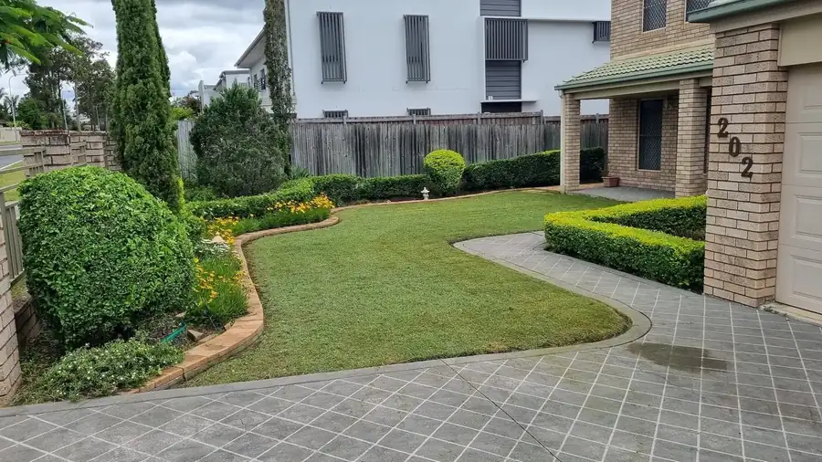 OnTime Landscape & Tree Maintenance carrying out hedging work in Parkinson