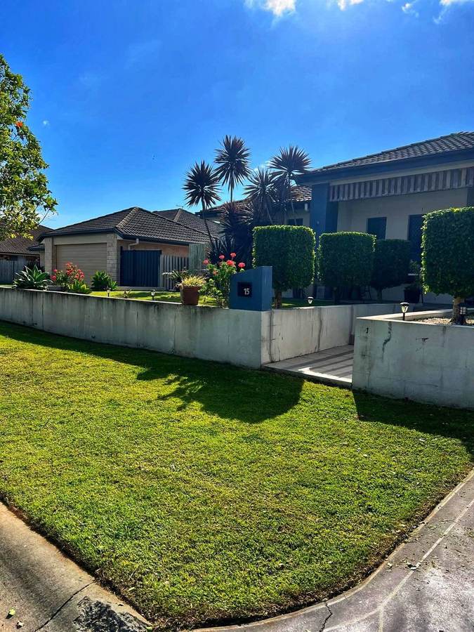 OnTime Landscape & Tree Maintenance carrying out hedging work in Brisbane