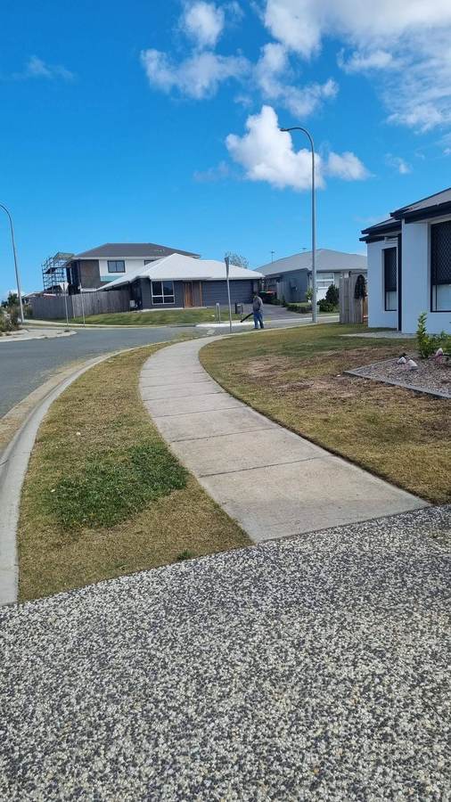 OnTime Landscape & Tree Maintenance carrying out lawn mowing work in Calamvale