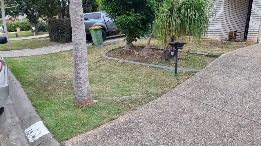 OnTime Landscape & Tree Maintenance carrying out lawn mowing work in Parkinson