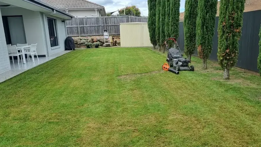 OnTime Landscape & Tree Maintenance carrying out lawn mowing work in Brisbane